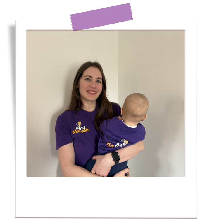 Karen holding baby with Mind Marvels t-shirts